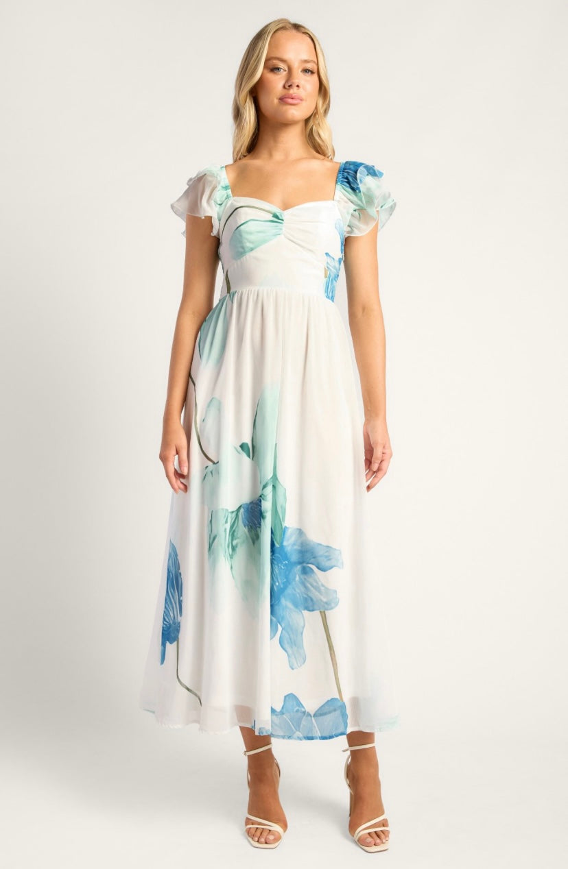 Woman wearing a floral dress on a white background